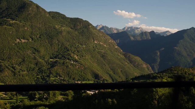 Winding roads across Italian Alps in Valle d'Aosta - Green and Lush 4K mountain scenary with moving camera