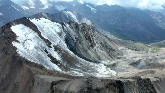 Aerial view of Chon Ashu pass with glaciers and alpine lakes in the mountains near Karakol, Issyk-Kul Region, Kyrgyzstan.
