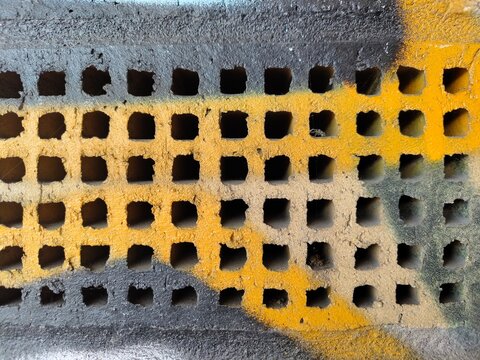Title: Grey and Gold Concrete Grid Texture with Spray Paint Detail