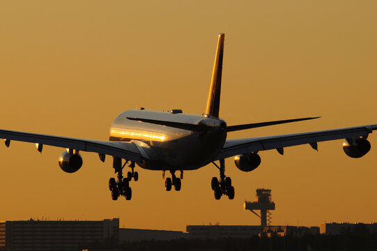 Lufthansa Airbus A340-313 D-AIGW approaching Frankfurt Airport at sunset
