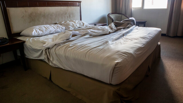 messy hotel bedroom