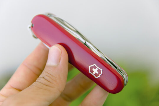 ZAPOPAN, MEXICO - AUGUST 24, 2026: Closed red Victorinox Super Tinker Swiss Army knife held in hand.