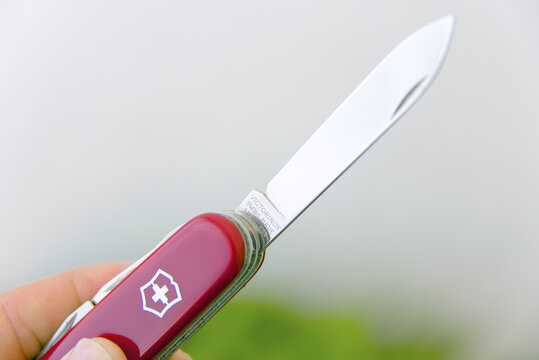 ZAPOPAN, MEXICO - AUGUST 24, 2026: Victorinox Super Tinker knife main blade showing logo imprint detail.