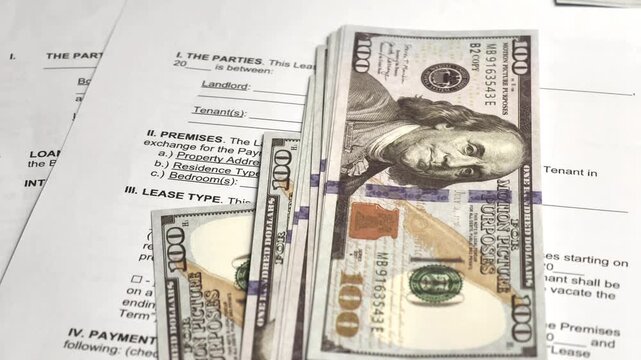 Cash scattered across a table, representing wealth, savings, financial planning, and monetary value.