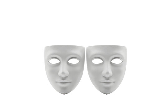 Two identical white plastic human face masks side by side on a plain white surface isolated on a transparent background