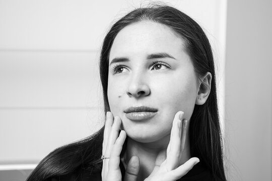 A picture of a very beautiful and attractive young lady, a portrait showing how satisfied she is after the lip rejuvenation procedure. This look is very popular on the market, attractive to clients.