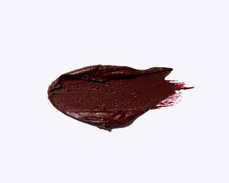 dark red burgundy plum lipstick smear, cosmetics beauty product texture, liquid blush, matte lip gloss swatch