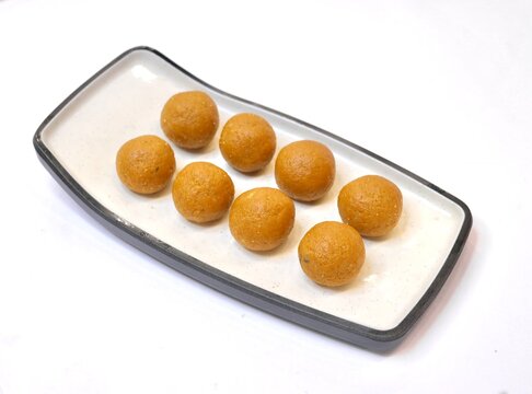 Besan laddoo decorate on white background