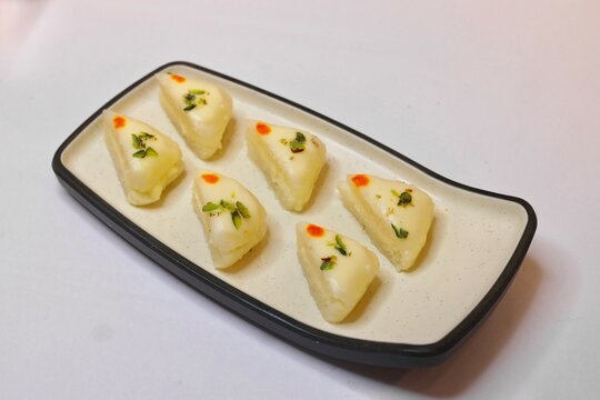 Malai sandwich or malai cham cham beautifully plated on white plate