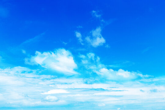 blue sky background with tiny clouds