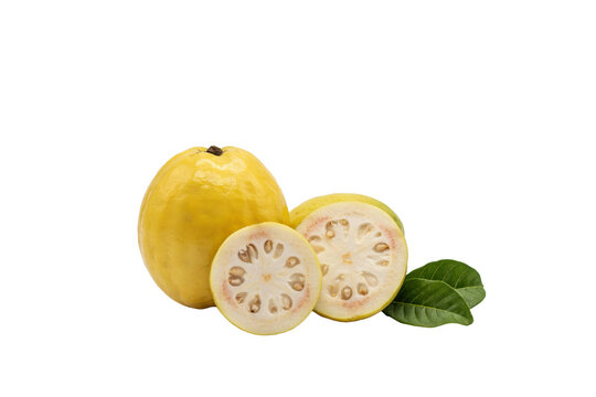 Whole yellow guava fruit with two sliced halves and green leaves isolated on a transparent background