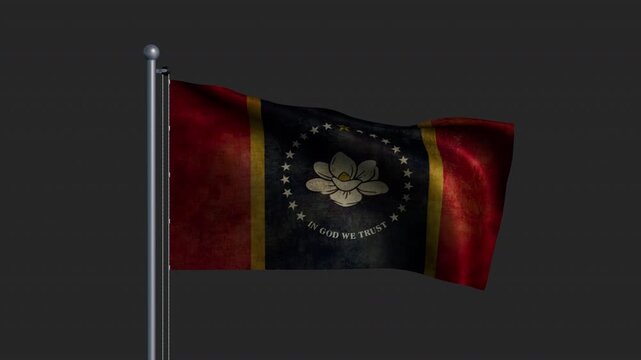 The Mississippi state flag on a pole with time-worn fabric waving in the wind