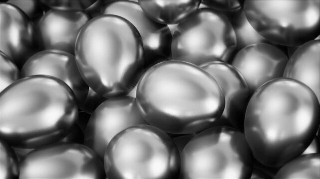 Stacked Silver Metal Eggs Loop