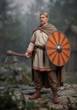 Historical warrior with wooden shield and battle axe standing outdoors