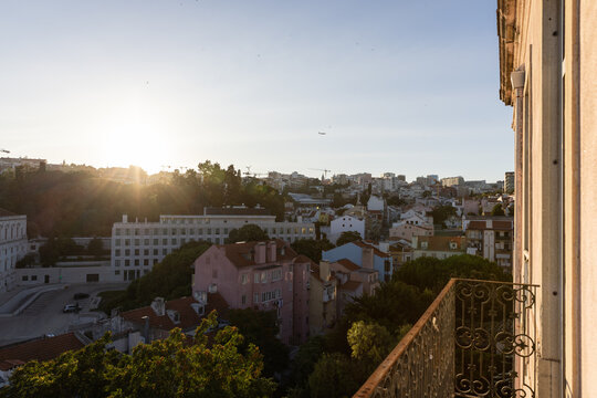 golden hour wide angle view of Lisbon neighborhood from residential balcony