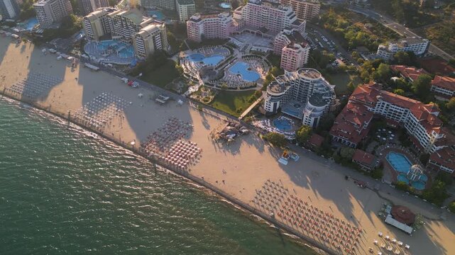 Aerial View of Sunny Beach Resorts, Sandy Coastline, and Swimming Pools