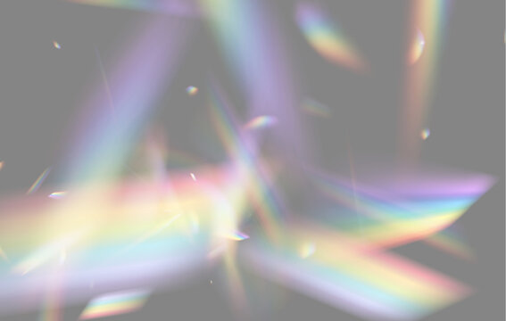 Intersecting beams of refracted light create vivid rainbow patterns on a black background. Soft, blurry streaks and sharp color fragments blend with a glowing iridescent effect.