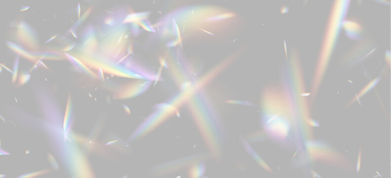 Multicolored prism light fragments scatter in various directions. These sharp, angular rays display a spectrum of vibrant colors on a dark background. The image captures dynamic optical.