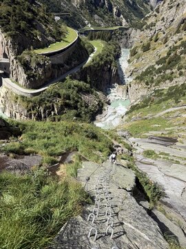 Via ferrata climbing route above a dramatic alpine gorge near Andermatt, Switzerland