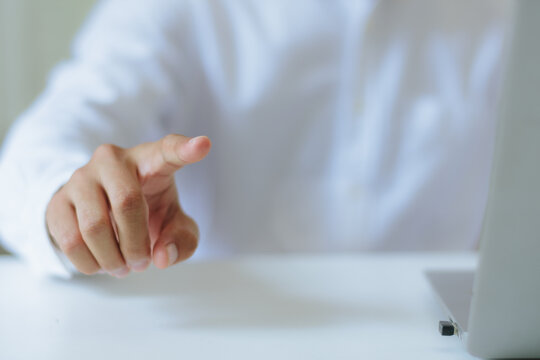 Businessman index finger pointing forward pressing virtual touchscreen interface