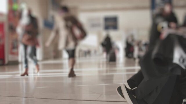 wide shot of crowd of people walking by and around in the airport Log ungraded