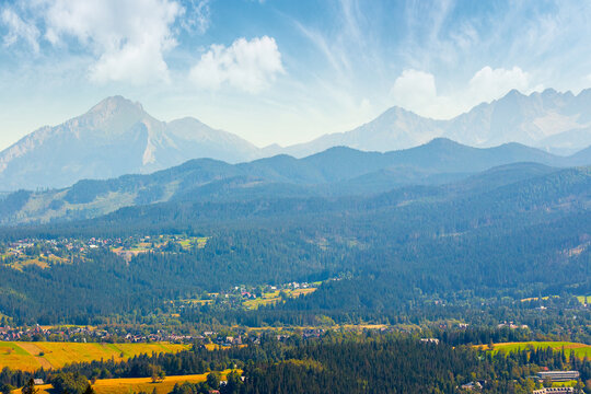 mountain landscape of Poland in late summertime. wonderful view of High Tatra ridge above Zakopane village valley. vacation place in Europe