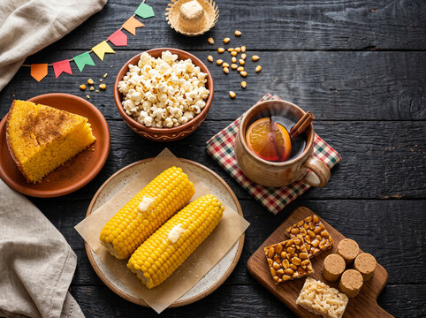 Traditional Brazilian Festa Junina Food Table with Corn Cake, Popcorn, Mulled Wine, and Sweets