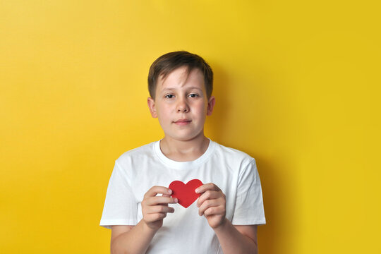 Boy Holding a Red Heart