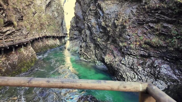 Majestic view from a wooden bridge over the Radovna River, flowing through the impressive Vintgar Gorge in the Triglav National Park