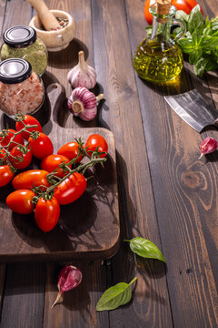 Fresh ingredients preparing for italian cooking on rustic table