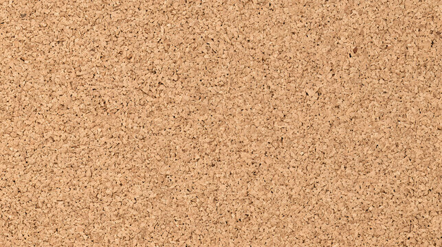 A close-up view of a textured cork surface, displaying natural variations and a warm brown hue.