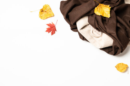 Autumn cloth and accessories at white background with copy space.