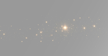 Small gold stars and glitter dust scattered around a bright glowing light with sparkling magic particles © theladydarina