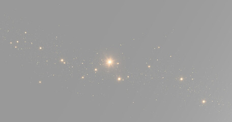Small gold stars and glitter dust scattered around a bright glowing light with sparkling magic particles © theladydarina