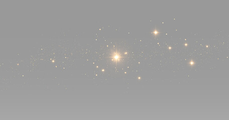 Small gold stars and glitter dust scattered around a bright glowing light with sparkling magic particles © theladydarina