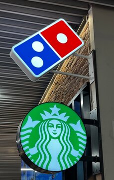 Greece, Rhodos, August 24. 2026, Starbucks and Domino's sign lettering logo Rhodos Airport