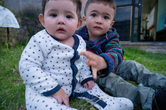 Close portrait of young brothers sharing a moment outdoors in rural Mexico.