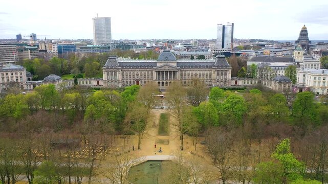 Aerial view of the Royal Palace of Brussels, Belgium, featuring its grand neoclassical facade, formal gardens and surrounding cityscape.