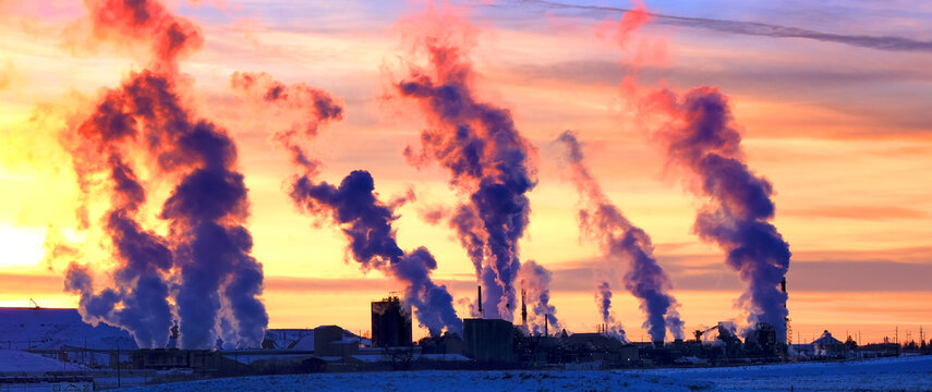 Factory Pumping Pollution Into Air Smokestack Environment Emissions at Sunset