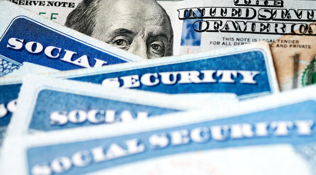 Social Security Cards with US One Hundred Dollar Bill $100