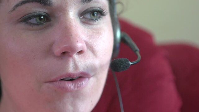 Female customer service agent talking on headset

