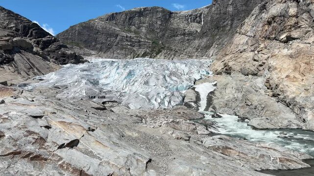 Nigardsbreen glacier toe in valley at sunny day, Norway