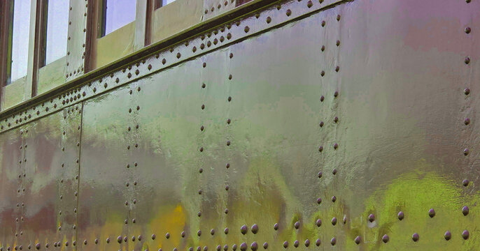 Riveted Steel Side of Train car, Sleeper Car, sleeping car, or wagon-lit car w/windows-train show-Transportation, antiques, old, vintage, shiny, colorful, rivets, rivet-Colors of Brown, gold, Yellow