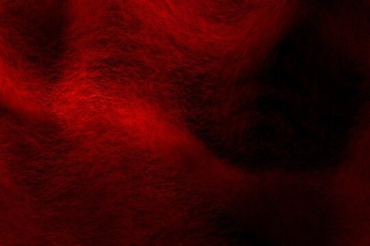 red woollen soft sinews on black background
