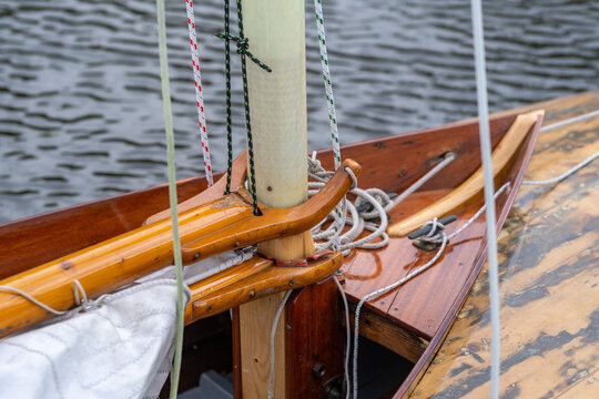 Close-up of the bow and mast of a traditional wooden sailing punt on the Norfolk Broads, highlighting its timber craftsmanship and nautical character.
