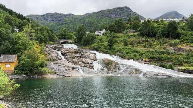 Bottom view of waterfall Hellesyltfossen in Hellesylt village, Norway