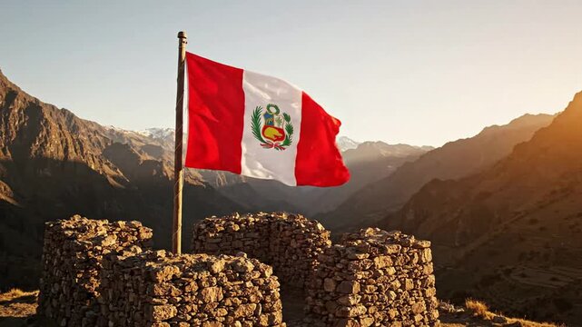 Peruvian flag waving over ancient inca stone ruins in the andes mountains at sunset