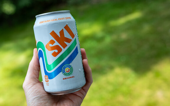 A person holding a Ski citrus soda can outdoors in summer (Minnesota, USA - Aug 14, 2026).