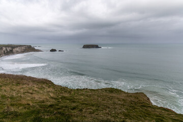 Fototapeta premium Scenic coastal landscape near Carrick-a-Rede Rope Bridge on the famous Causeway Coast Route in County Antrim, Northern Ireland