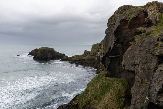 Scenic coastal landscape near Carrick-a-Rede Rope Bridge on the famous Causeway Coast Route in County Antrim, Northern Ireland